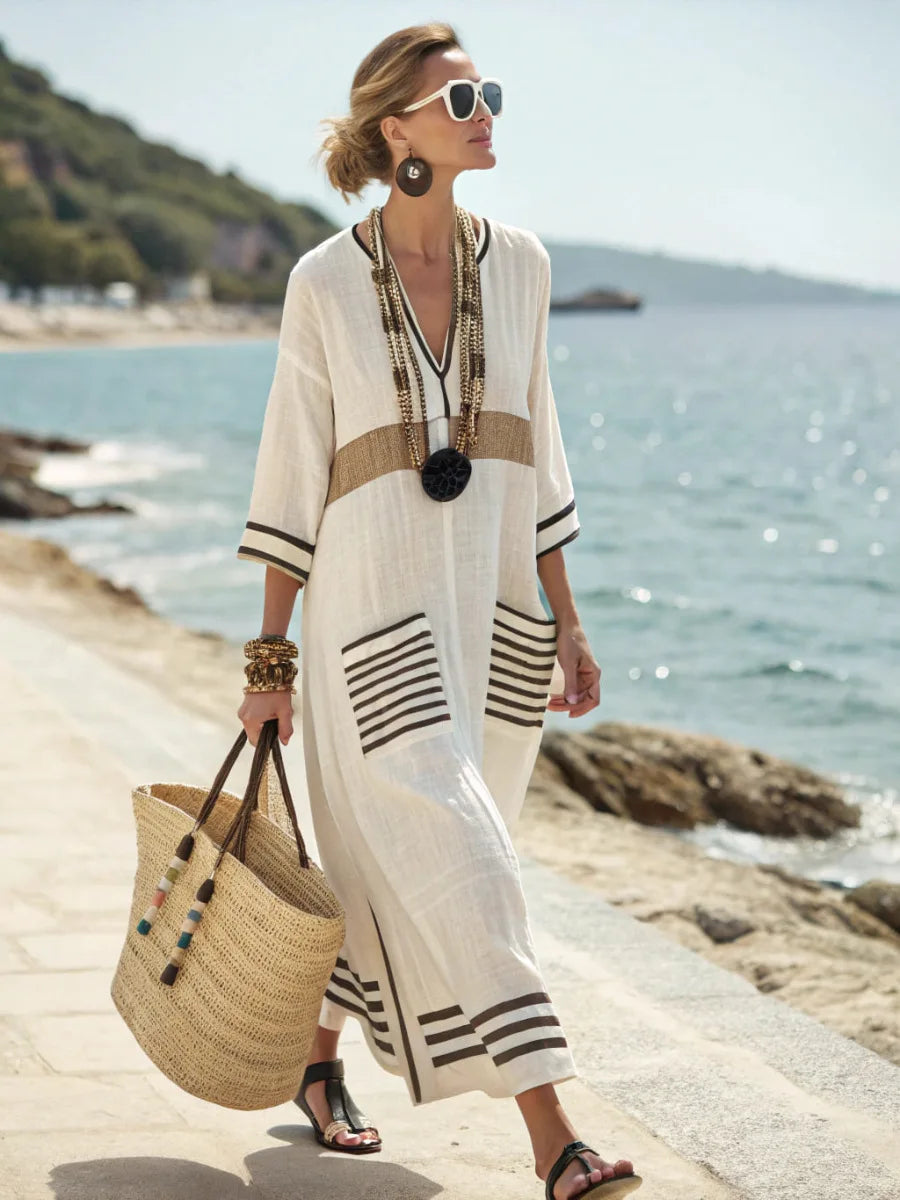 Front view of the Elara loose fit maxi dress in black, showcasing its elegant drape and V-neckline.