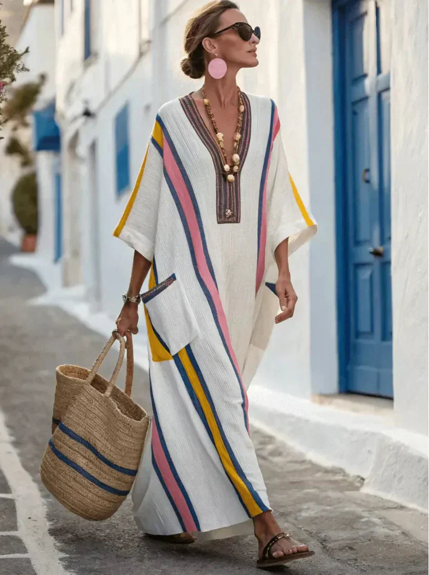 A model casually walking in the light blue Elara loose fit maxi dress, emphasizing its effortless movement.